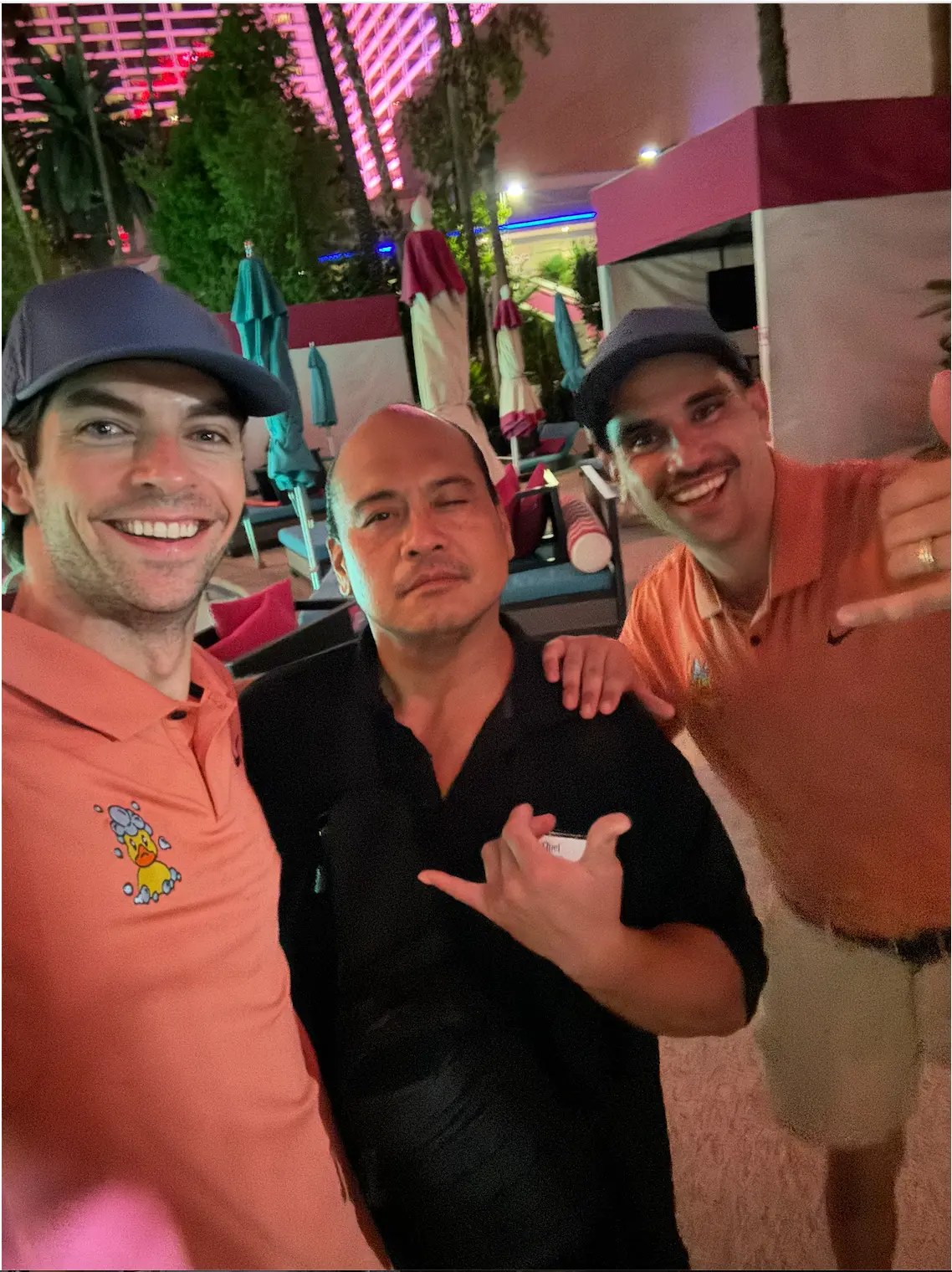 Squeaky crew with a property manager giving an after-hours quote and demo on a pool deck